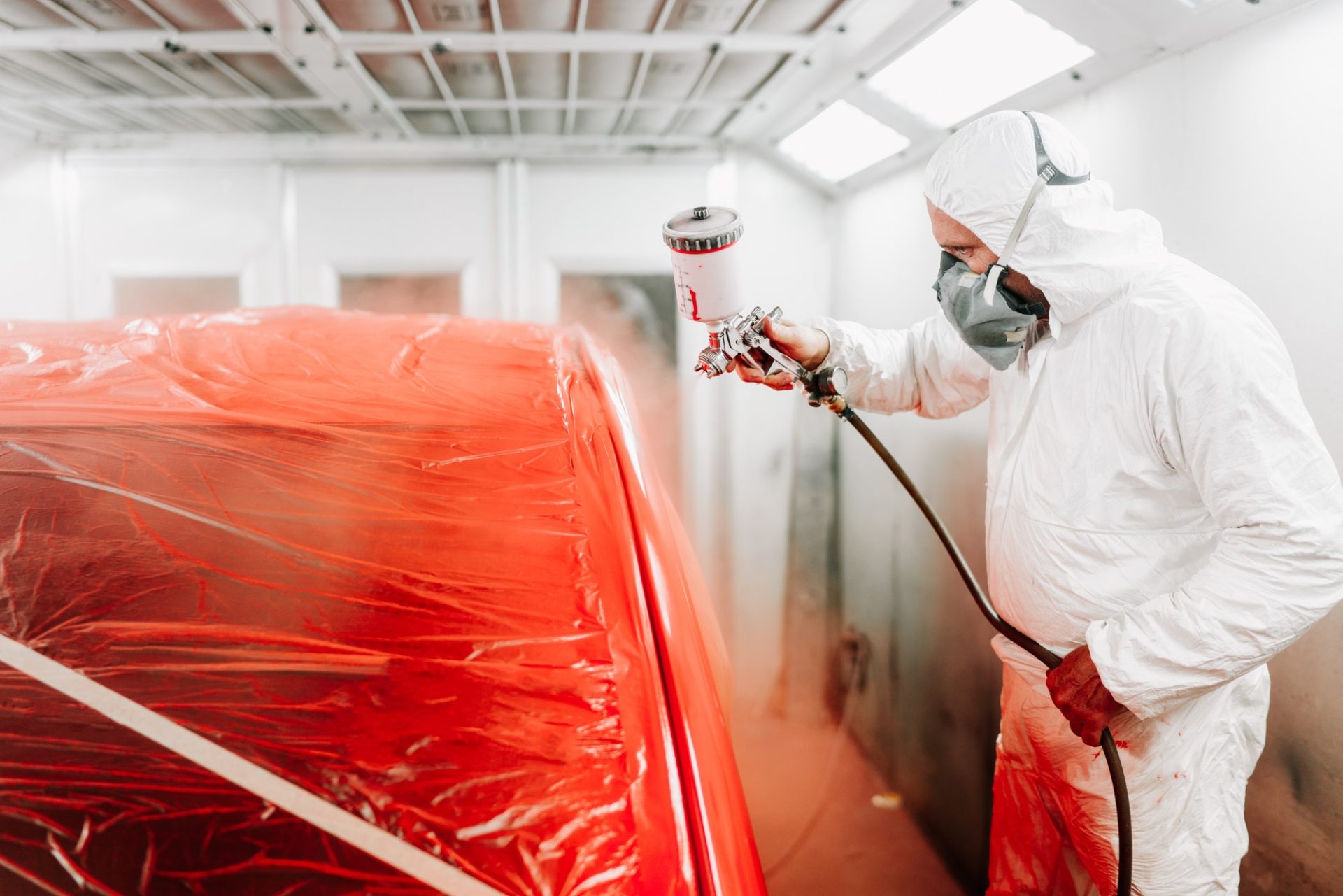 automotive-industry-engineer-using-spray-gun-and-painting-a-red-car-e1635819622219.jpg automotive-industry-engineer-using-spray-gun-and-painting-a-red-car-e1635819622219.jpg
