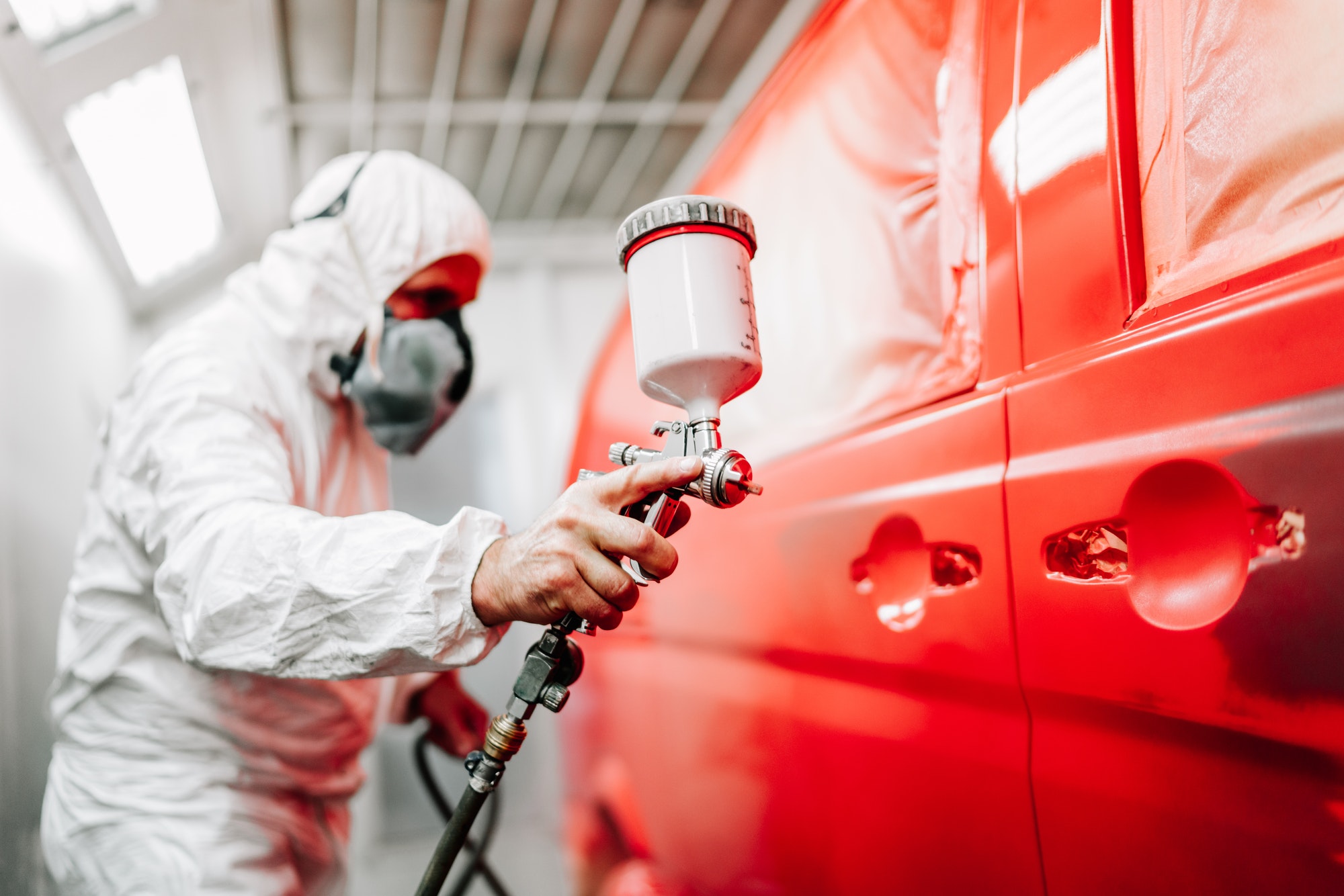 close-up-of-worker-using-spray-gun-and-airbrush-and-painting-a-red-car.jpg close-up-of-worker-using-spray-gun-and-airbrush-and-painting-a-red-car.jpg