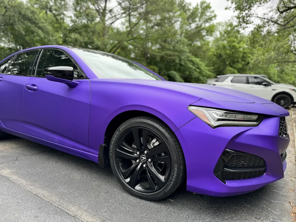 Side view of a purple car with full vinyl wrap by WrapItUp365