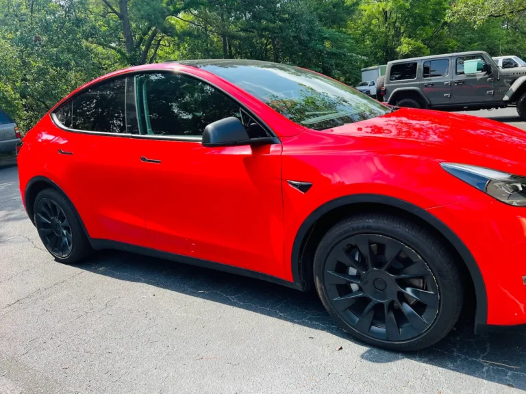 Side view of a red car with full vinyl wrap by WrapItUp365